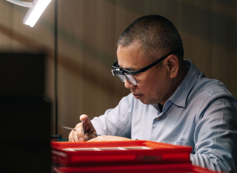 Intricate mechanical watch mechanism with gears and circuit board